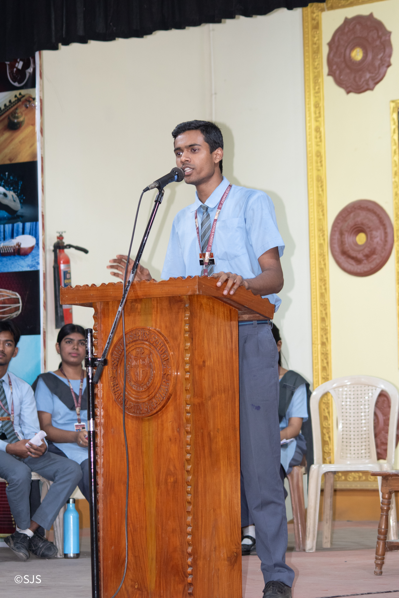 Students debating on stage
